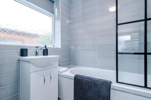 Shower, hair dryer, towels