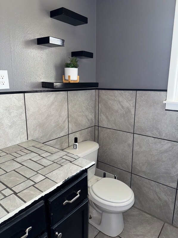 Shower, towels, soap, toilet paper