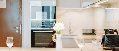 Luxury Room, Balcony, City View | Private kitchen | Full-size fridge, microwave, oven, stovetop