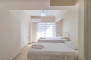 Apartment, City View, Garden Area | Iron/ironing board, free WiFi