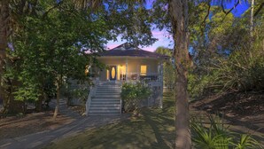 A house with a porch, steps, and a door. - The Captains Deck, Steps to Beach, Family Friendly (Folly Beach)