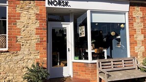 A building with a sign reading "Norsk." - Pass the Keys |Modern Penthouse Style Apartment in Haddenham (Aylesbury)