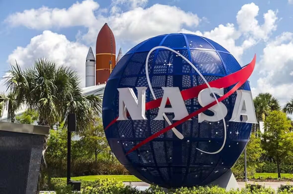 A large NASA logo with a rocket in the background.