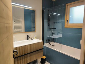 Shower, hair dryer, towels, soap