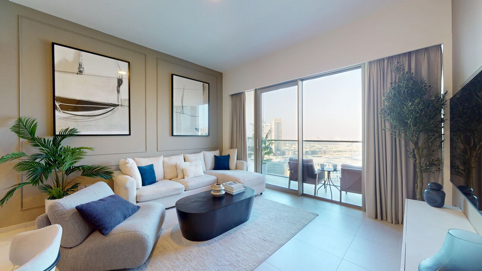 A modern living room with a sofa set, a coffee table, and a balcony with a view.