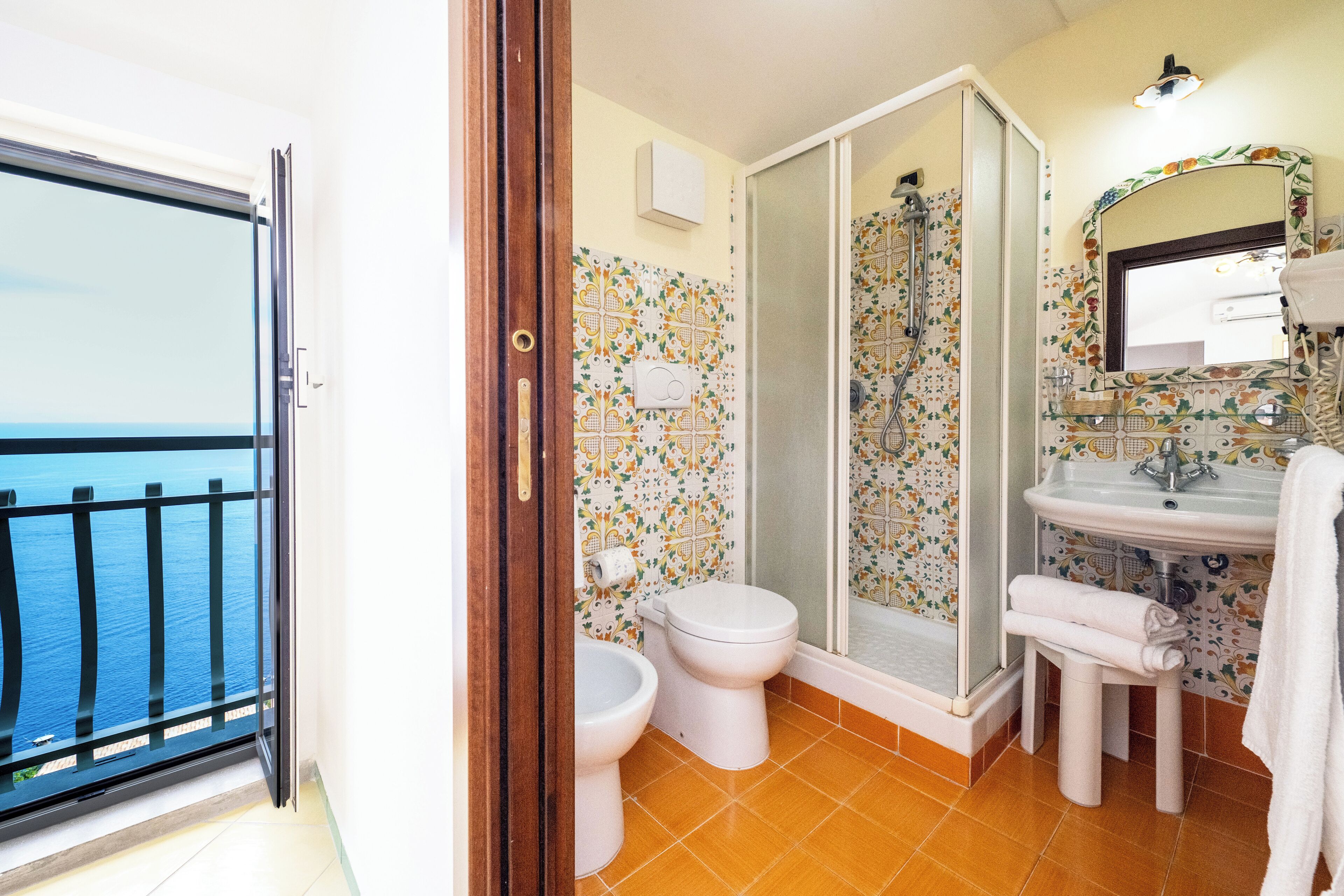 Standard Quadruple Room, Patio, Sea View | Bathroom | Shower, free toiletries, hair dryer, towels