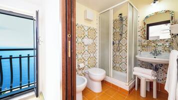 Standard Quadruple Room, Patio, Sea View | Bathroom | Shower, free toiletries, hair dryer, towels