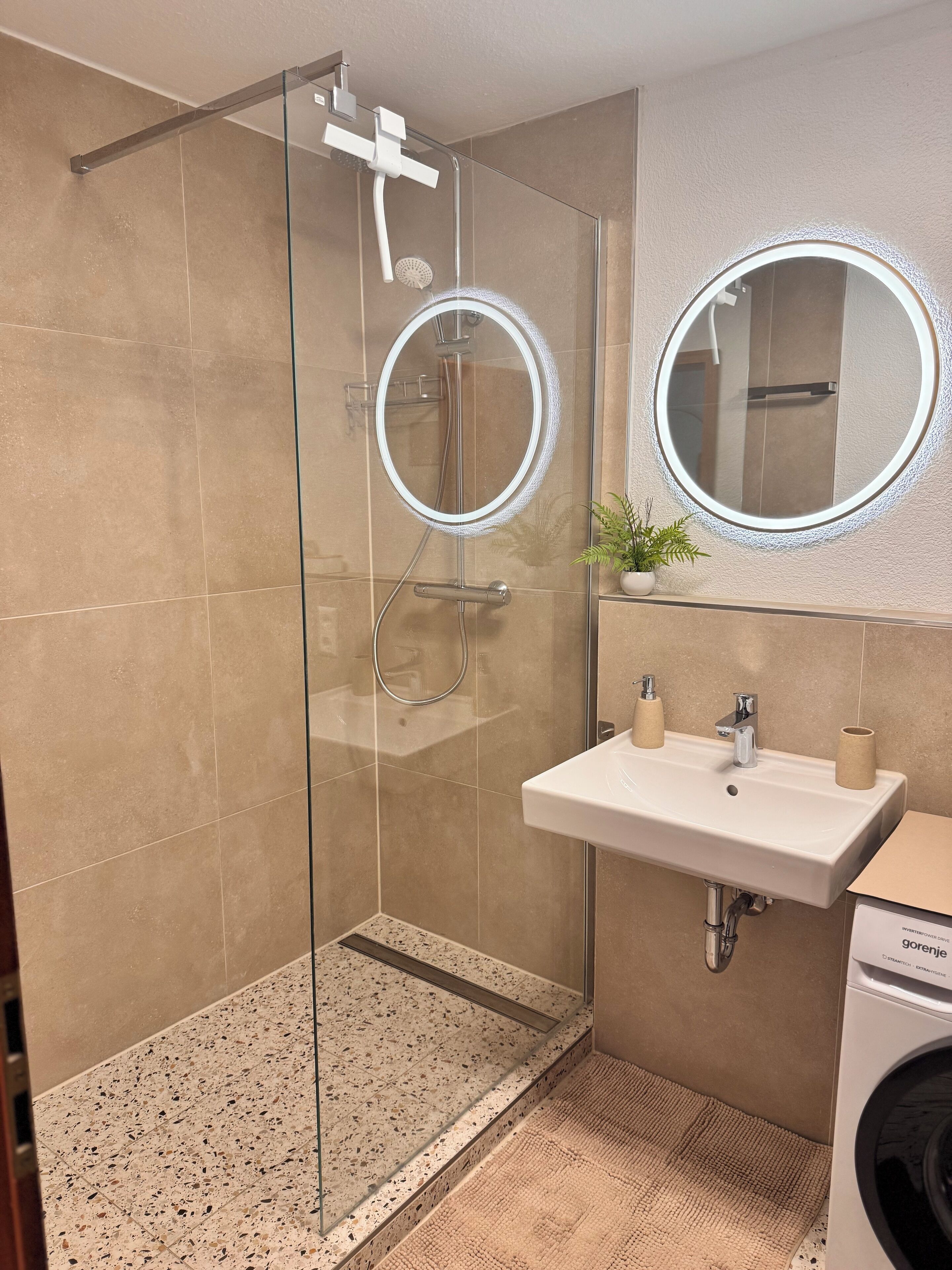 Shower, towels, soap, toilet paper