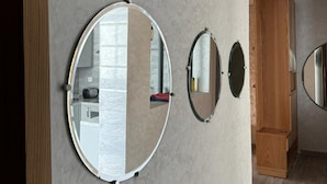 A room with a wooden wardrobe, a mirror, and a wooden cabinet. - Your Holiday Home in Agadir (Agadir)
