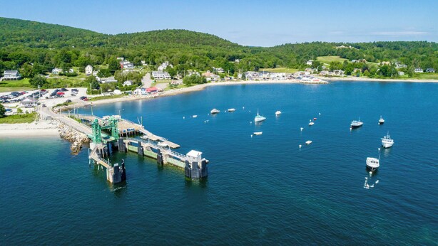A coastal town with a marina, boats, and a bridge connecting to the mainland. - Resort style, family friendly getaway! (Lincolnville)