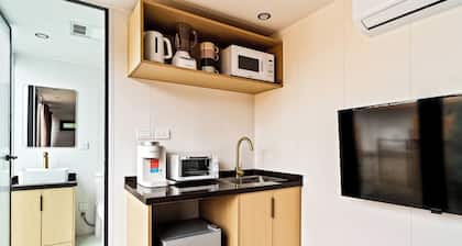 LUXX Space Cabin Tiny House with rooftop deck, private fenced patio.