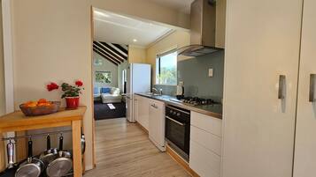 Fridge, oven, toaster, dining tables