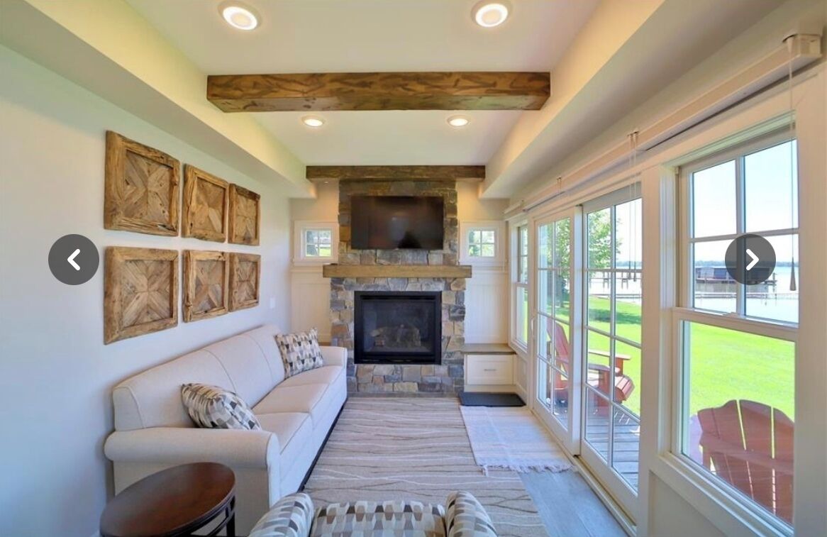 Smart TV, fireplace, books, computer monitors