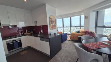 Design Apartment, River View | Private kitchen | Espresso maker, coffee/tea maker, electric kettle, highchair