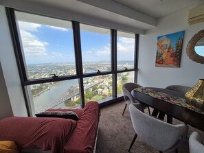 Design Apartment, River View | Living area | 60-inch Smart TV with digital channels, Netflix, streaming services - Arabian Nights-Level 60-Meriton Suites (Brisbane)