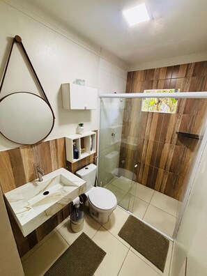 Shower, hair dryer, towels, toilet paper