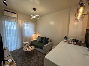 Room, 2 Bedrooms, Balcony, Pool View | Living area - Room-cozy Place Near Eastwood (Pasig)