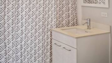 Shower, towels, soap, toilet paper