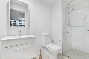 Shower, hair dryer, towels, toilet paper