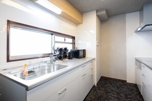 Lyxpenthouse - utsikt mot staden | Eget kök | Kylskåp, mikrovågsugn, spishäll och grytor/köksredskap