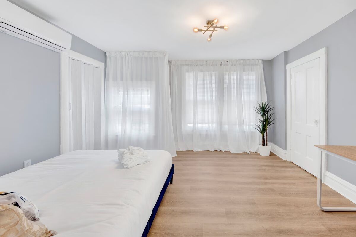 Desk, laptop workspace, blackout curtains, iron/ironing board