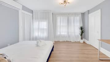 Desk, laptop workspace, blackout curtains, iron/ironing board