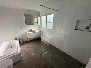 Shower, towels, soap, toilet paper