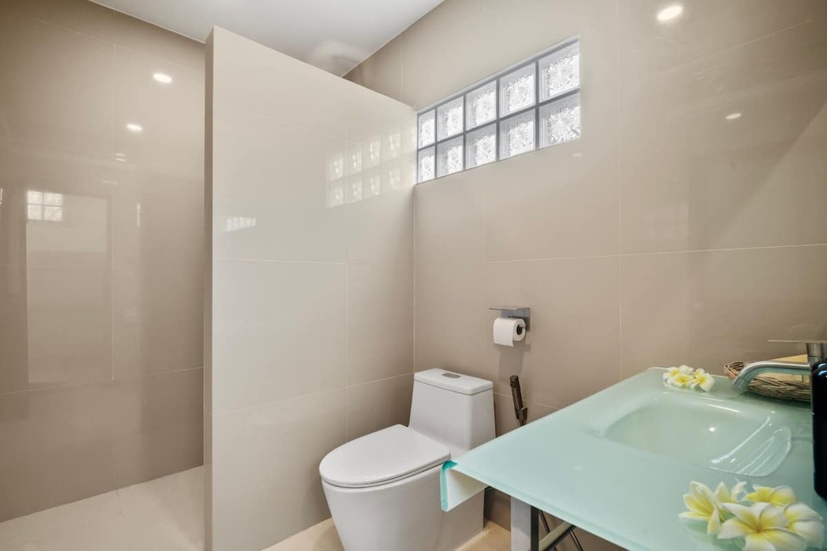 Comfort Room, Garden View | Bathroom | Shower, hair dryer, towels, soap