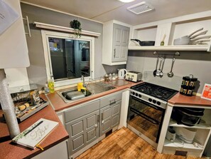 Cottage | Private kitchen | Cookware/dishes/utensils - Kingfisher Caravan Park - Holiday Accommodation 22193 (Skegness)