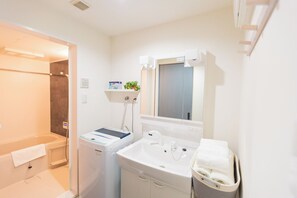 Family Room, Balcony, City View | Bathroom | Separate bathtub and shower, free toiletries, hair dryer, slippers - b&Kishinosato (Osaka)