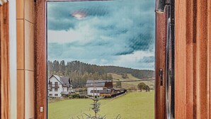 A bathroom with a window view of a rural landscape, a sink, and a small plant. - Nasza Chata- hottub, fireplace, kids-friendly, grill, workspace, free parking (Kacwin)