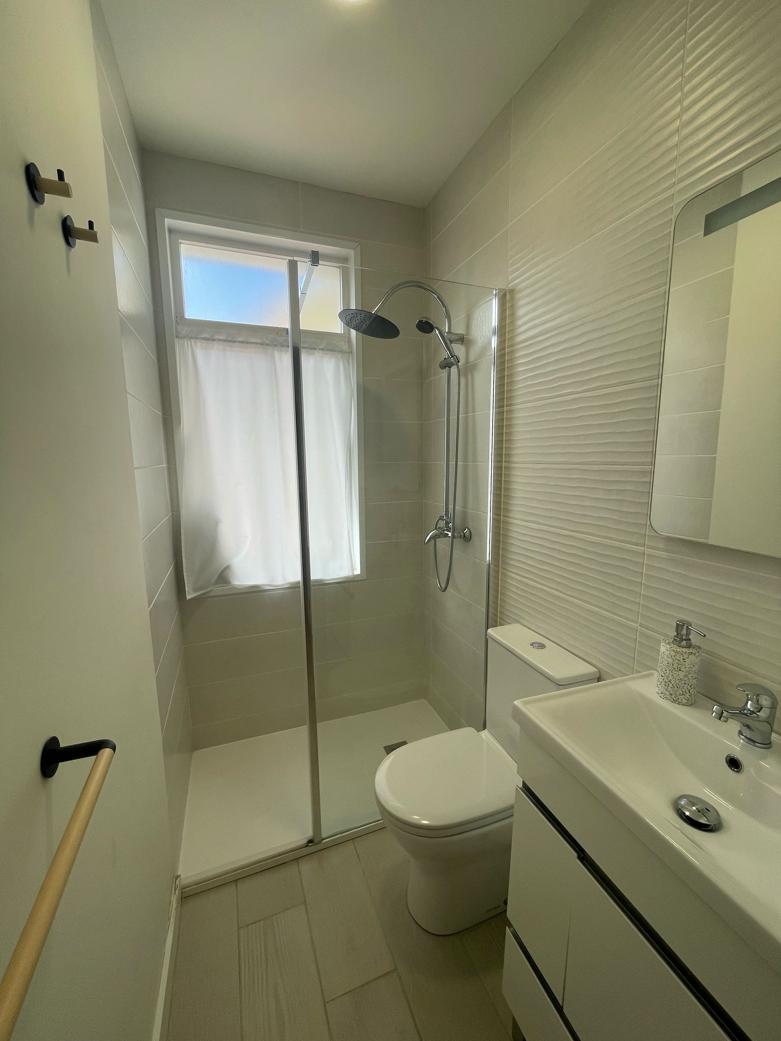 Shower, hair dryer, towels, toilet paper