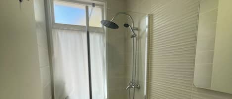 Shower, hair dryer, towels, toilet paper
