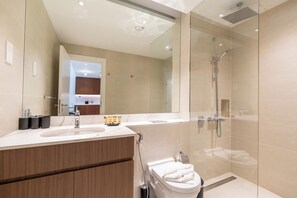 Exclusive Apartment, Balcony, Partial Sea View | Bathroom | Shower, hair dryer, towels, soap