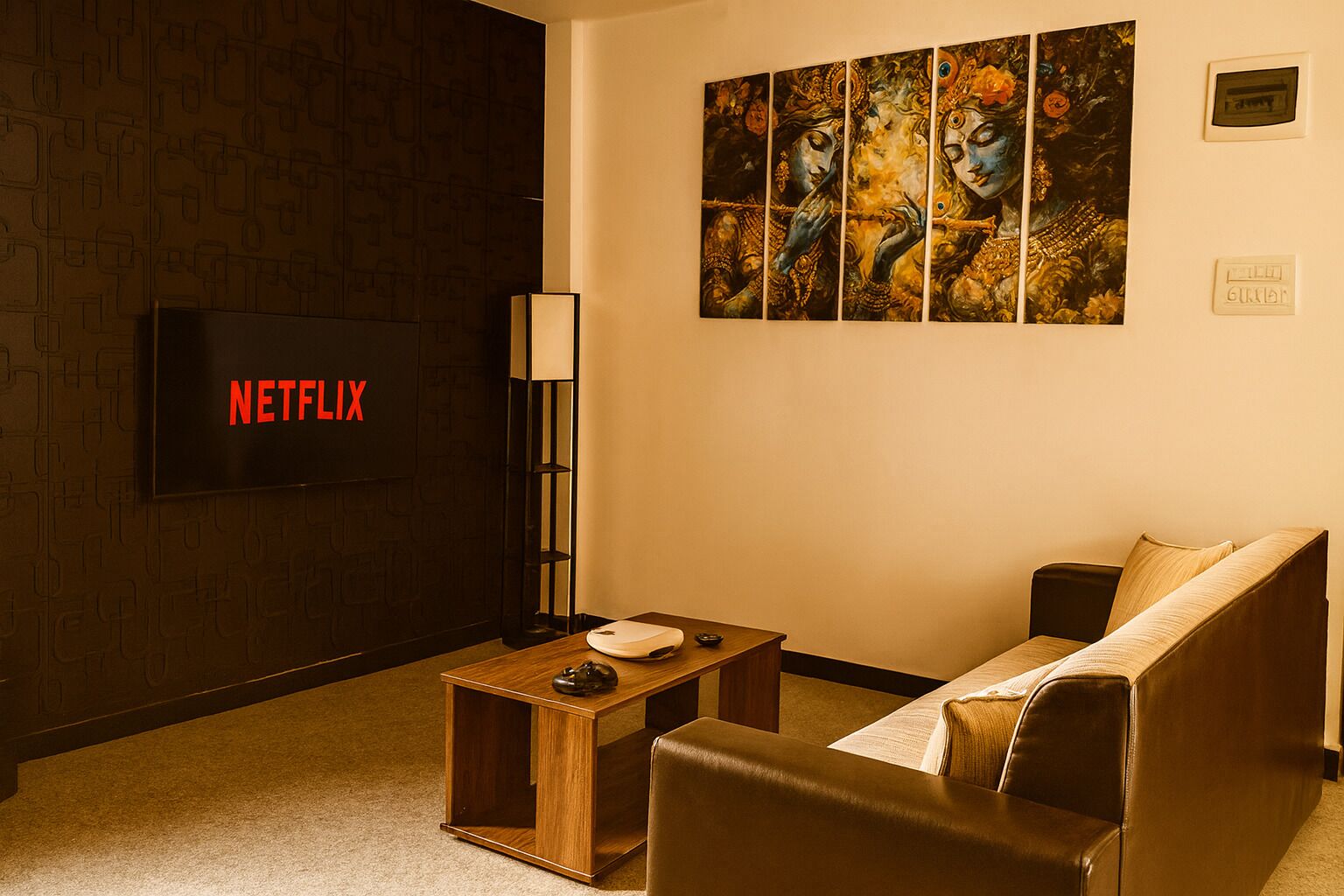 A cozy living room with a flat-screen TV, a coffee table, a sofa, and a wall-mounted painting.