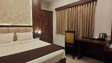 Deluxe Double Room, City View | Desk, laptop workspace, free WiFi