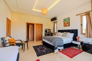 Luxury Suite, Pool View | Blackout drapes, soundproofing, iron/ironing board, free WiFi