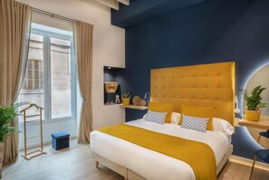 A bedroom with a large bed, a headboard, a bedside table, a window with curtains, and a small shelf with decorative items. - Can Vidal Boutiques Rooms (Inca)