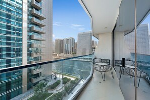 Deluxe Apartment, Balcony, Canal View | Balcony - Chic 1BR Canal View at Waves Tower (Dubai)