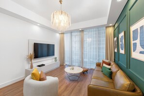 Deluxe Apartment, Balcony, Canal View | Living area - Chic 1BR Canal View at Waves Tower (Dubai)