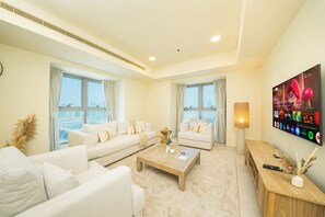 Luxury Apartment, Partial Sea View | Living room | 55-inch Smart TV with digital channels - PVH - 3BR & Maids Room - Princess Tower (Dubai)