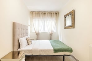 Departamento est ándar | Tabla de planchar con plancha, wifi gratis y ropa de cama 