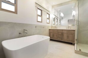 Shower, hair dryer, towels, shampoo