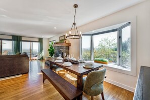 Dining - Bright hilltop retreat with stunning mountain views, wrap-around windows, and cozy seating to take it all in. Nestled on a private, scenic property minutes from charming Cambridge village—perfect for a peaceful getaway year-round. (cambridge)