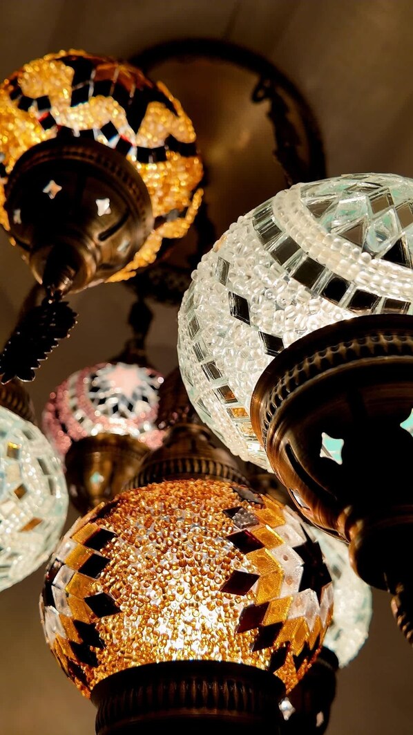 A chandelier with multiple spherical glass elements. - Designer West Town Retreat • Game Room + Deck (Chicago)