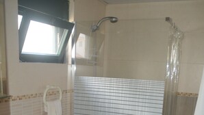 A bathroom with a sink, toilet, and shower. - Beach apartment stanza mare (Punta Cana)