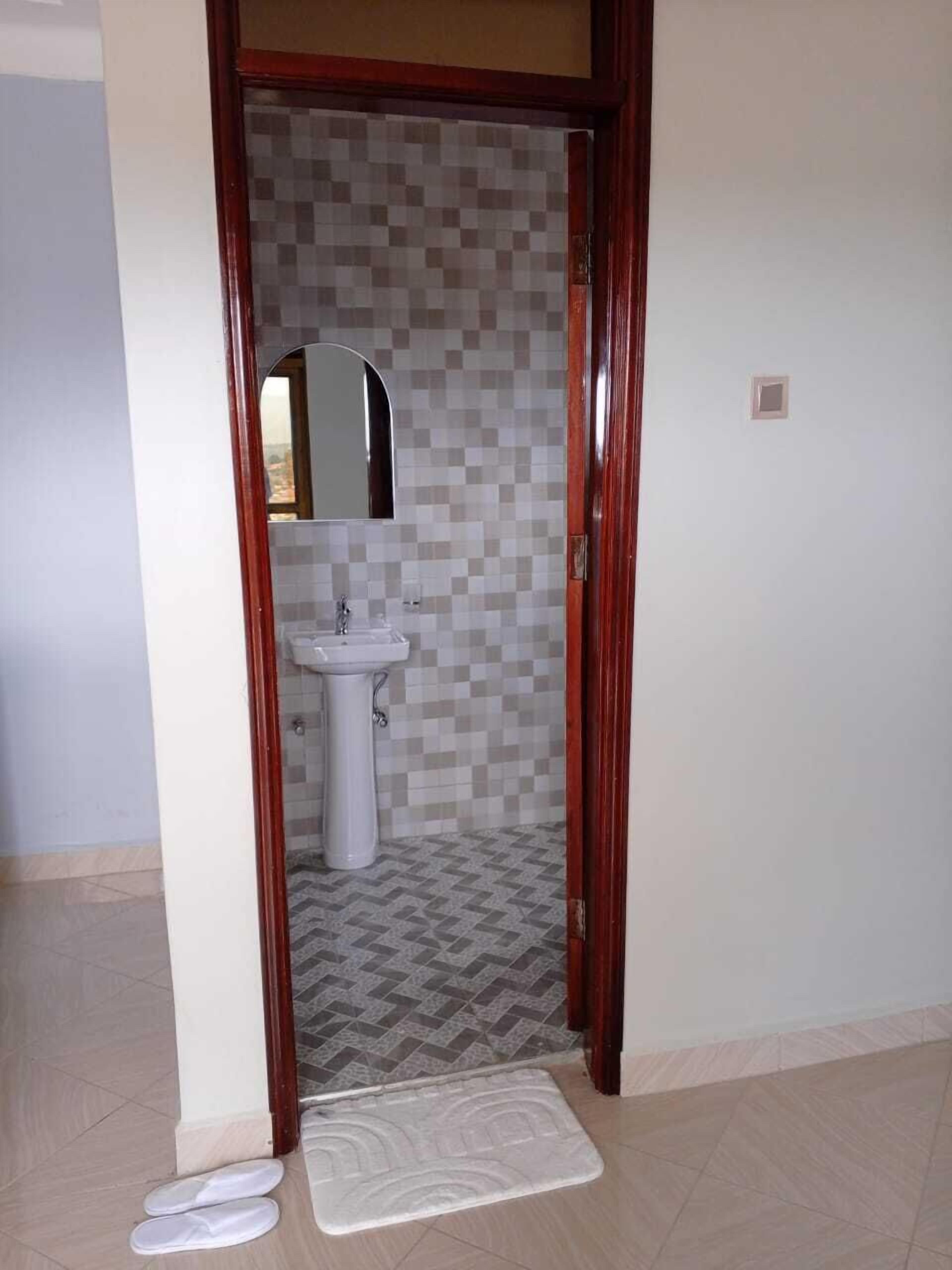 Shower, slippers, towels, soap