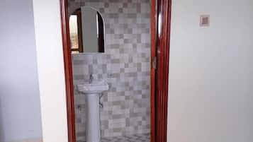 Shower, slippers, towels, soap