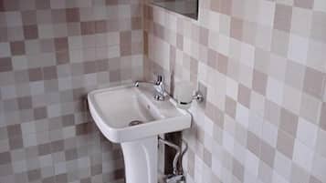Shower, slippers, towels, soap