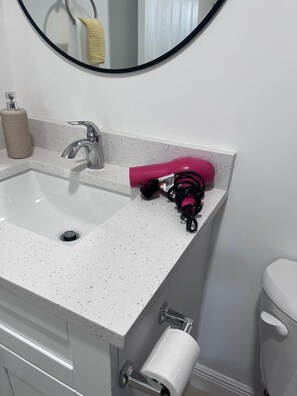 Hair dryer, towels, soap, shampoo
